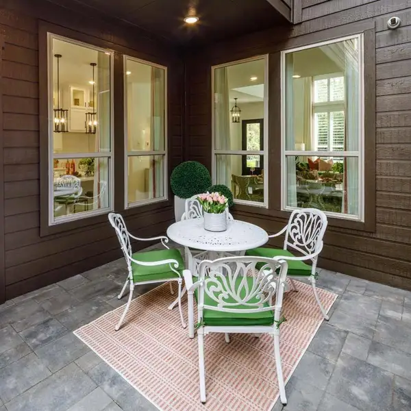 Exterior details and patio area of a home in Woodforest Townhomes, Montgomery (Image 21).