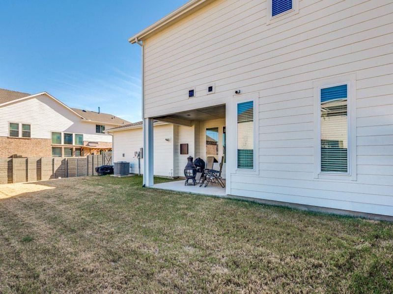 Exterior details and patio area of a home in Terrace Collection at Harvest, Argyle (Image 3).