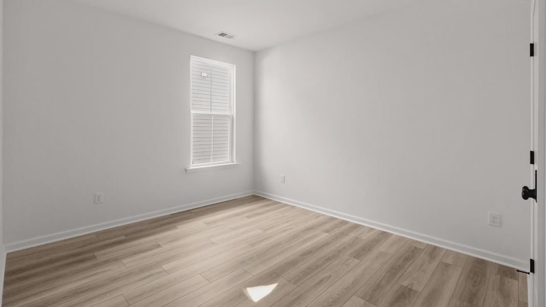 Bedroom 3 in the Easton plan offers a versatile space with natural light and clean finishes.