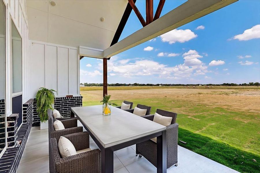 View of patio featuring outdoor dining space and a view of countryside