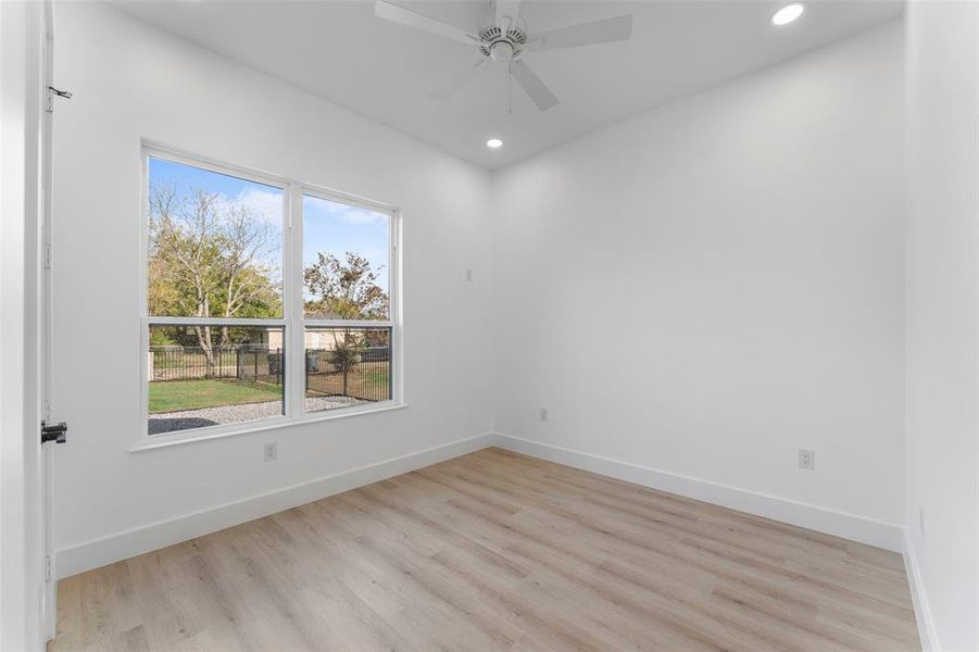 Spare room with light wood-type flooring, recessed lighting, and a ceiling fan