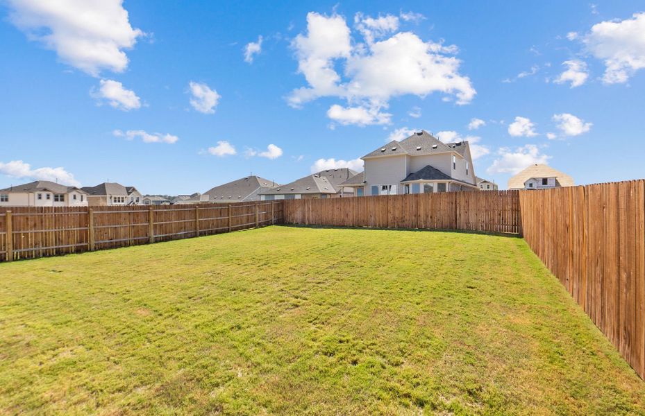 Exterior details and patio area of a home in Saddleback at Santa Rita Ranch, Liberty Hill (Image 25). Exterior details and patio area of a home in Saddleback at Santa Rita Ranch, Liberty Hill (Image 25).