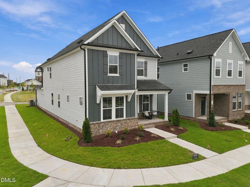 Front exterior of a new home in Forestville Yard, Knightdale, NC, highlighting curb appeal (Image 2). Front exterior of a new home in Forestville Yard, Knightdale, NC, highlighting curb appeal (Image 2).