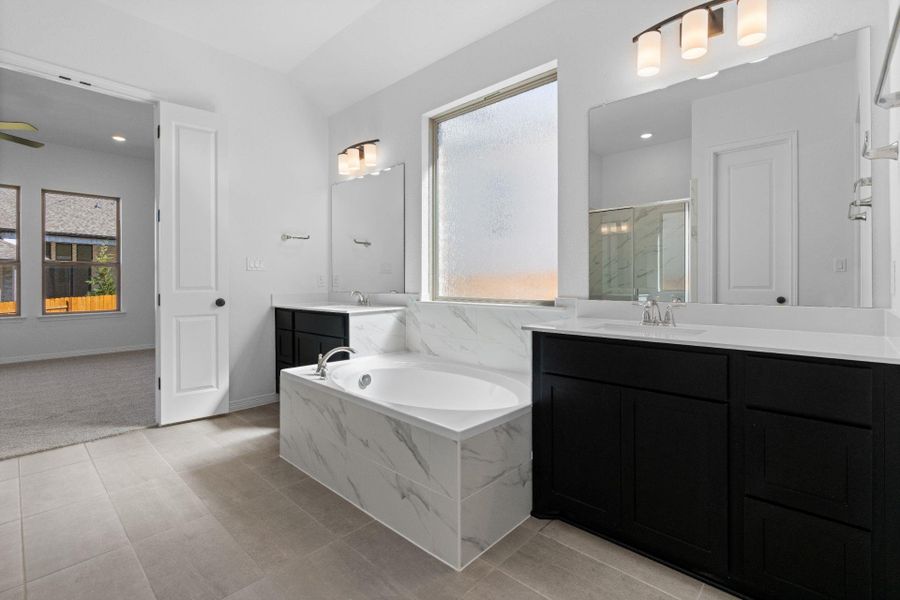 Primary Bath retreat with dual vanities & garden tub
