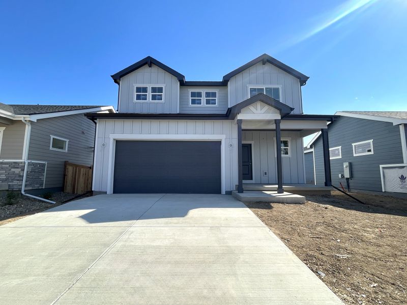Front exterior of a new home in Granary, Johnstown, CO, highlighting curb appeal (Image 2). Front exterior of a new home in Granary, Johnstown, CO, highlighting curb appeal (Image 2).