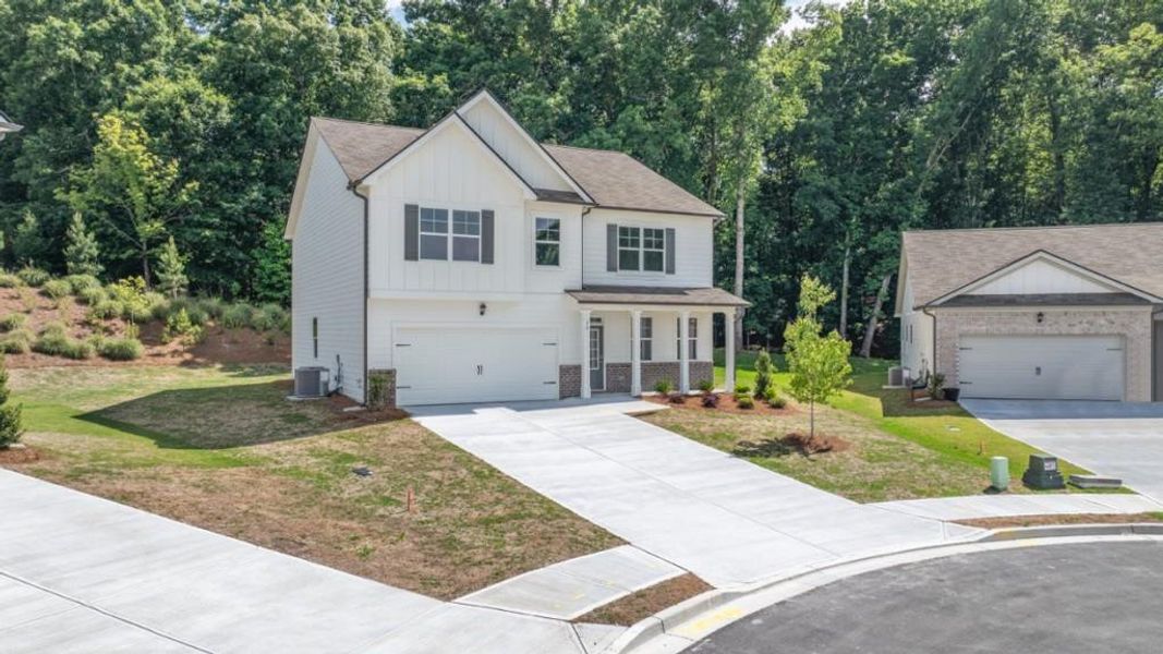 Front exterior of a new home in Liberty Crossing, Braselton, GA, highlighting curb appeal (Image 2). Front exterior of a new home in Liberty Crossing, Braselton, GA, highlighting curb appeal (Image 2).