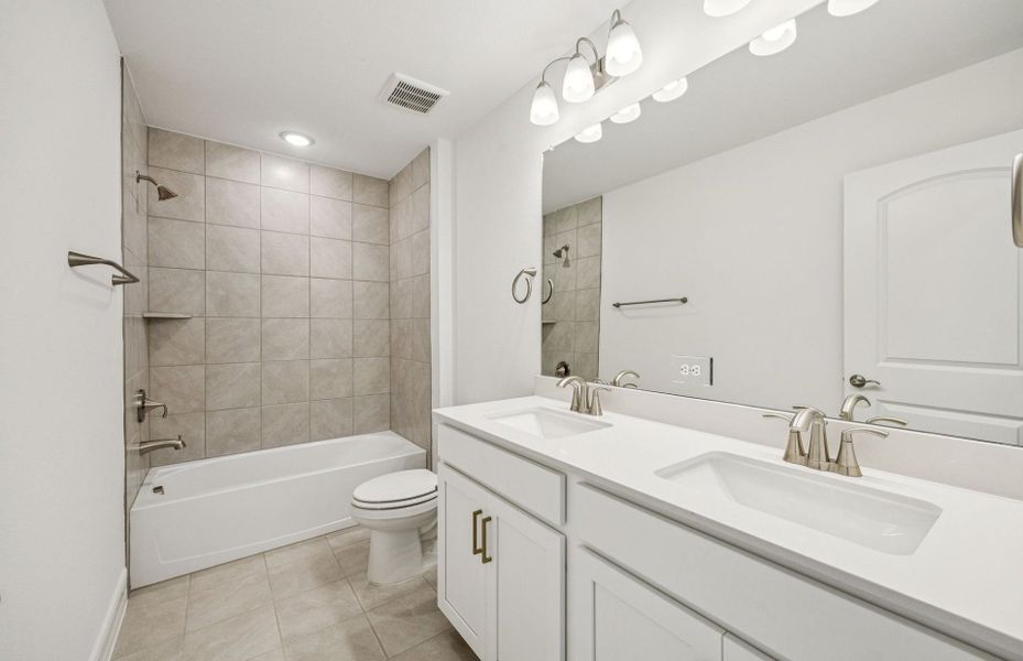 Upgraded secondary bath with elegant finishes  *Real home pictured