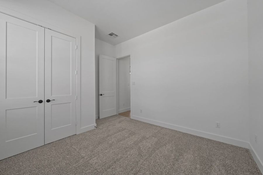Representative unfurnished interior of a home built from the Augusta by Chesmar Homes in Riceland Alley Loads, Mont Belvieu (Image 25).