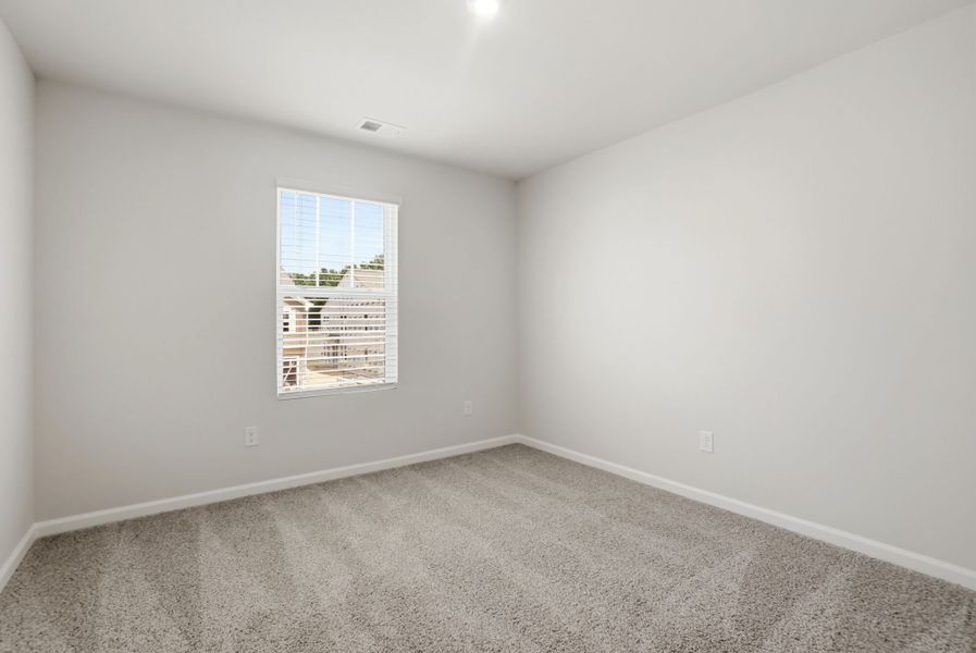Spacious, unfurnished interior of a new home in Stonesummit at Reedy Creek, Charlotte (Image 18).