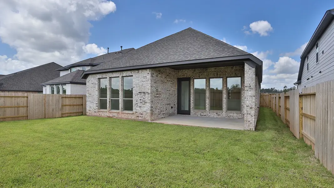 Front exterior of a new home in Grand Central Park 50', Conroe, TX, highlighting curb appeal (Image 2). Front exterior of a new home in Grand Central Park 50', Conroe, TX, highlighting curb appeal (Image 2).