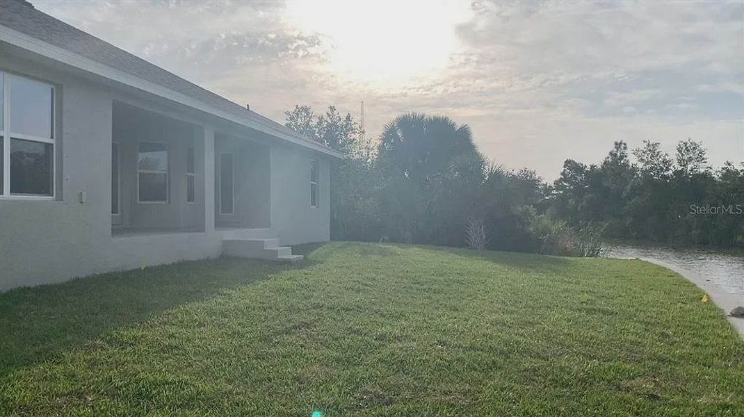 Front exterior of a new home in South Gulf Cove, Port Charlotte, FL, highlighting curb appeal (Image 21). Front exterior of a new home in South Gulf Cove, Port Charlotte, FL, highlighting curb appeal (Image 21).