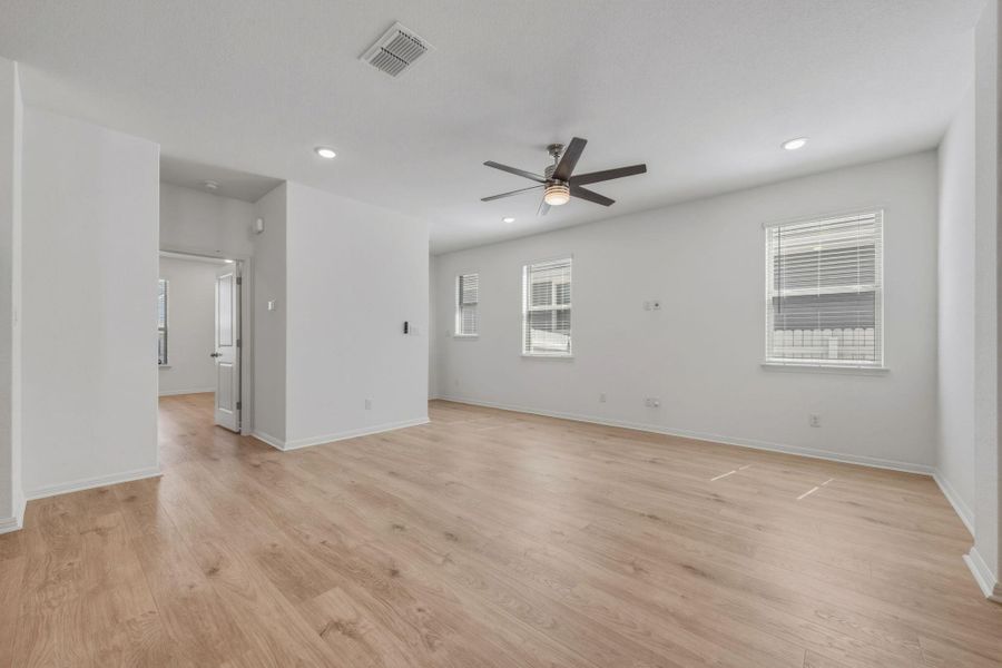 Unfurnished room featuring a ceiling fan, recessed lighting, and light wood-style flooring