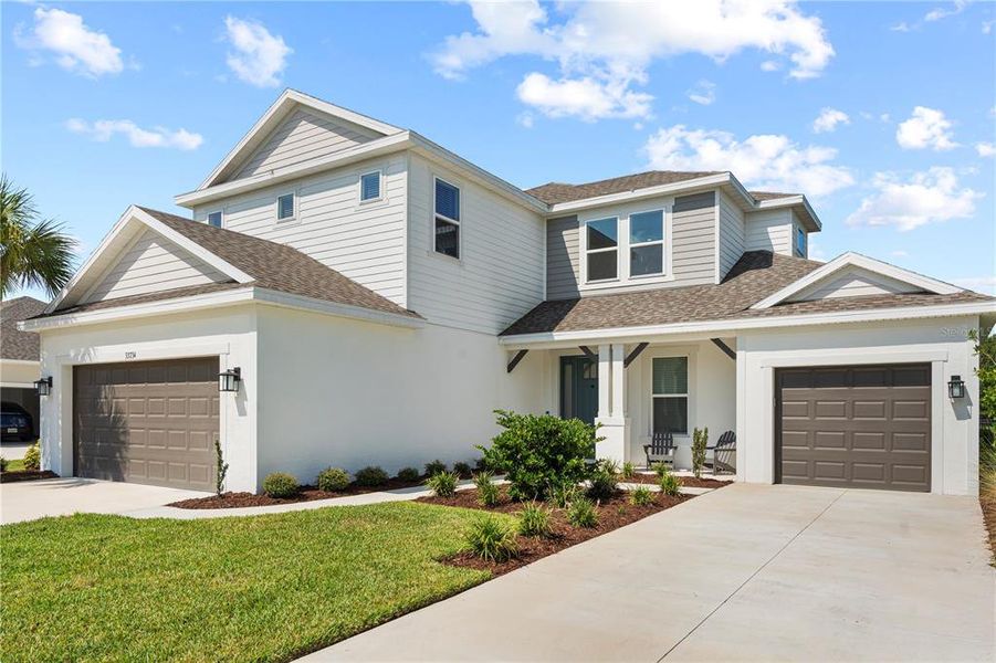 Front exterior of a new home in , Wesley Chapel, FL, highlighting curb appeal (Image 22).