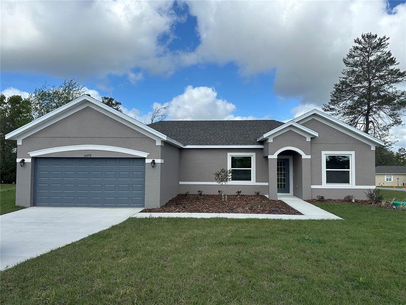 Front exterior of a new home in Ocala, Ocala, FL, highlighting curb appeal (Image 2). Front exterior of a new home in Ocala, Ocala, FL, highlighting curb appeal (Image 2).