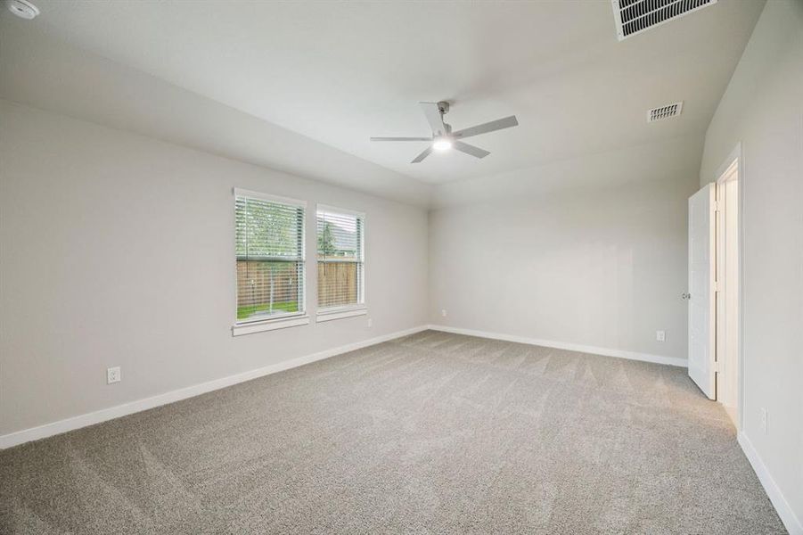 Primary Suite in the Oscar home plan by Trophy Signature Homes – REPRESENTATIVE PHOTO