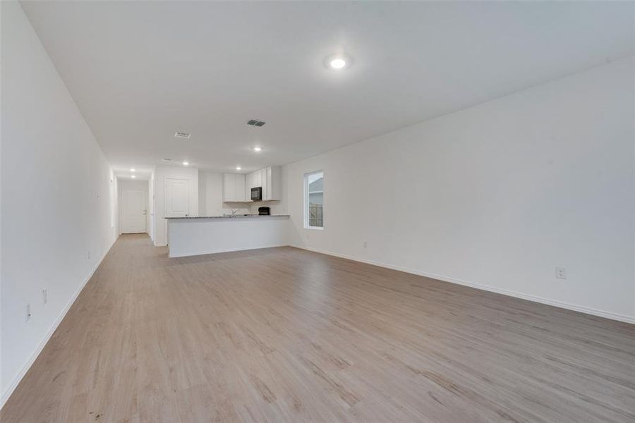 Unfurnished living room with light hardwood / wood-style flooring