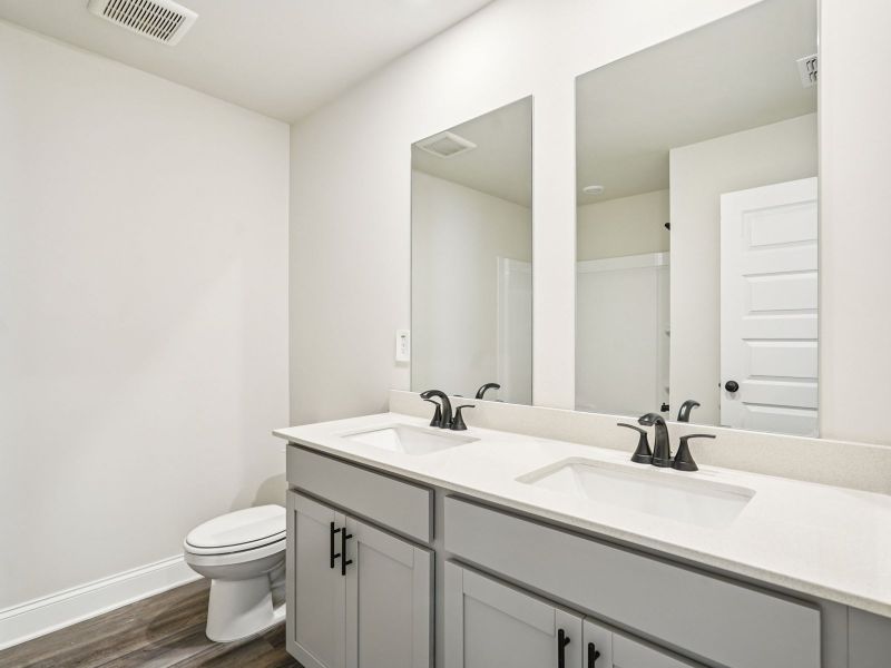 Furnished interior view inside a new home in Martin Springs - Estate Series, Lawrenceville (Image 9).