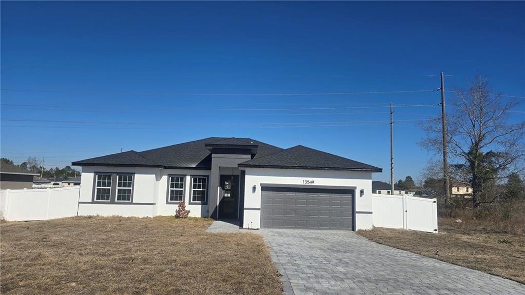 Front exterior of a new home in , Ocala, FL, highlighting curb appeal (Image 1). Front exterior of a new home in , Ocala, FL, highlighting curb appeal (Image 1).