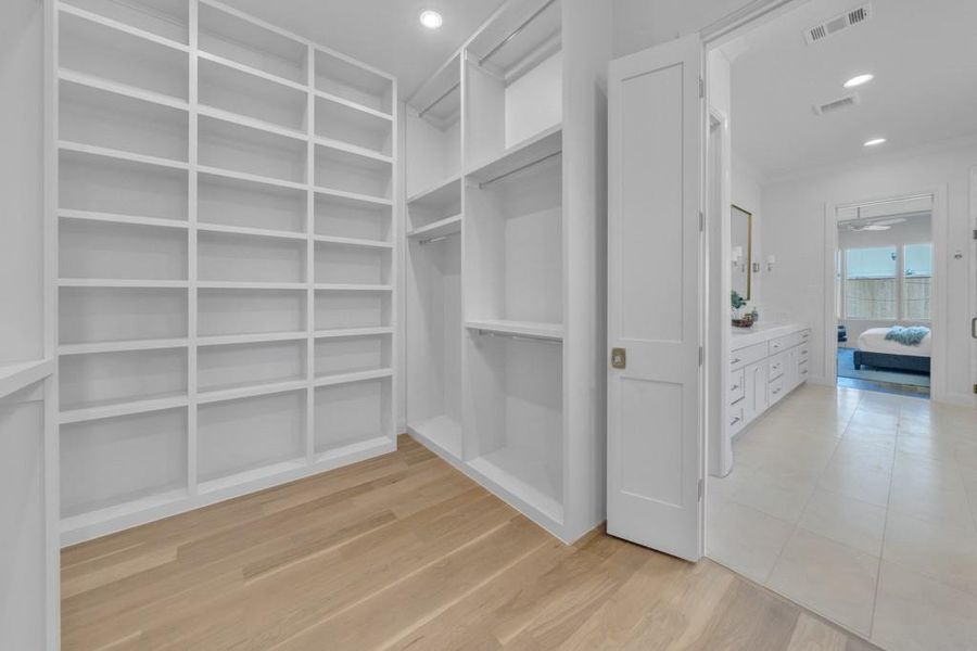 Spacious closet featuring visible vents and light wood finished floors