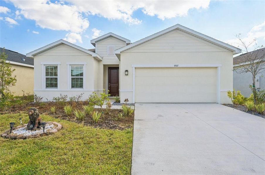 Front exterior of a new home in , Parrish, FL, highlighting curb appeal (Image 1).