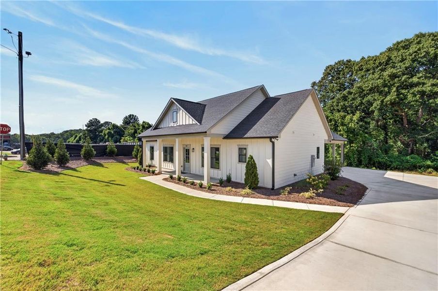 Front exterior of a new home in , Monroe, GA, highlighting curb appeal (Image 21).