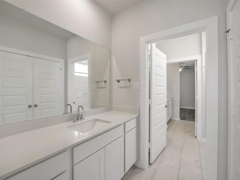 Furnished interior view inside a new home in Sunterra, Katy (Image 20).