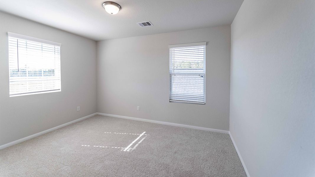 Spacious, unfurnished interior of a new home in The Canopies, Splendora (Image 32).