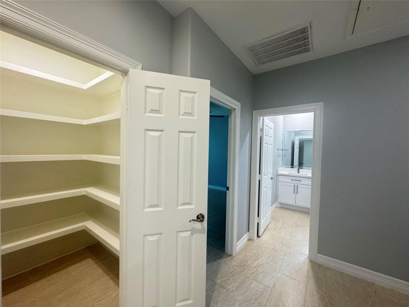 Hallway leading pantry and other bedrooms