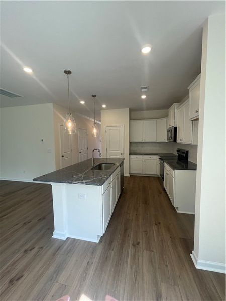 Furnished interior view inside a new home in Springwood Grove, Central (Image 5).