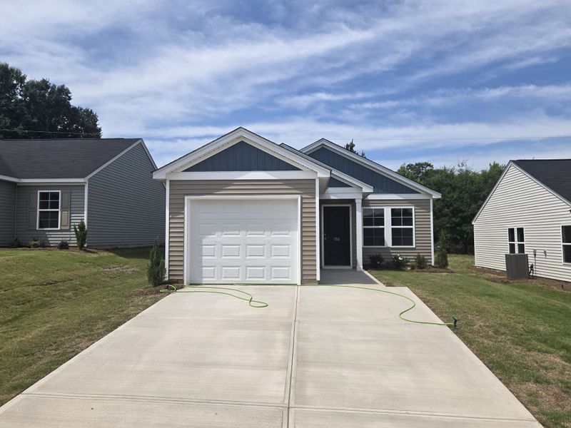 Front exterior of a new home in Evergreen, Spartanburg, SC, highlighting curb appeal (Image 1). Front exterior of a new home in Evergreen, Spartanburg, SC, highlighting curb appeal (Image 1).