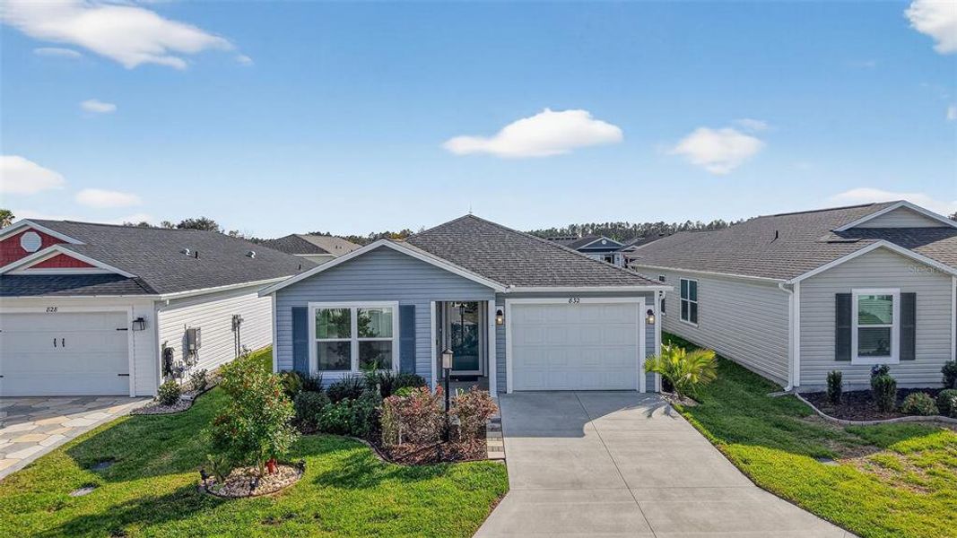 Front exterior of a new home in , The Villages, FL, highlighting curb appeal (Image 23).