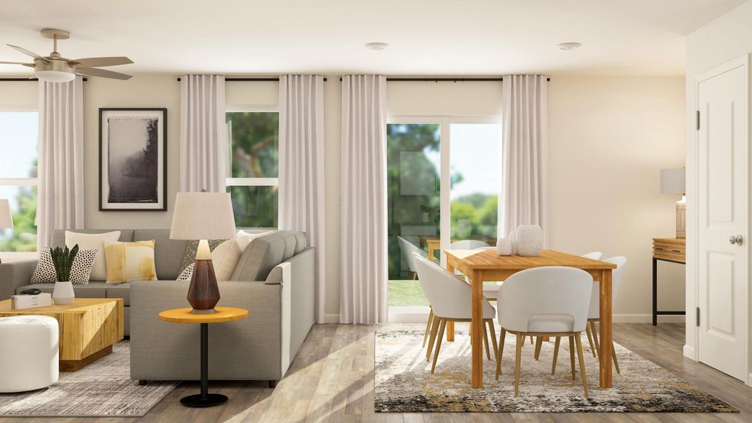 A living room with a table and chairs.