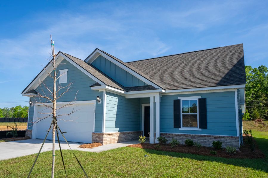 Front exterior of a new home in Monroe Preserve, Chapin, SC, highlighting curb appeal (Image 24). Front exterior of a new home in Monroe Preserve, Chapin, SC, highlighting curb appeal (Image 24).