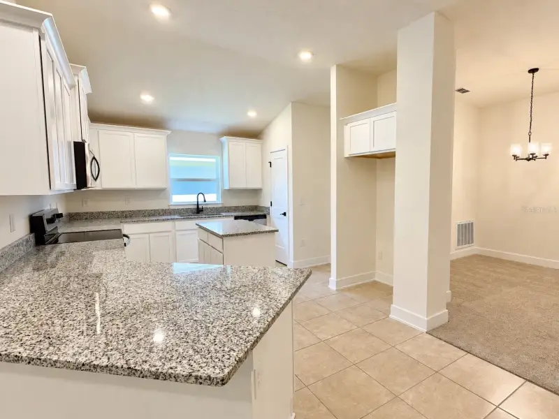 Furnished interior view inside a new home in Harmony Central, St. Cloud (Image 6).