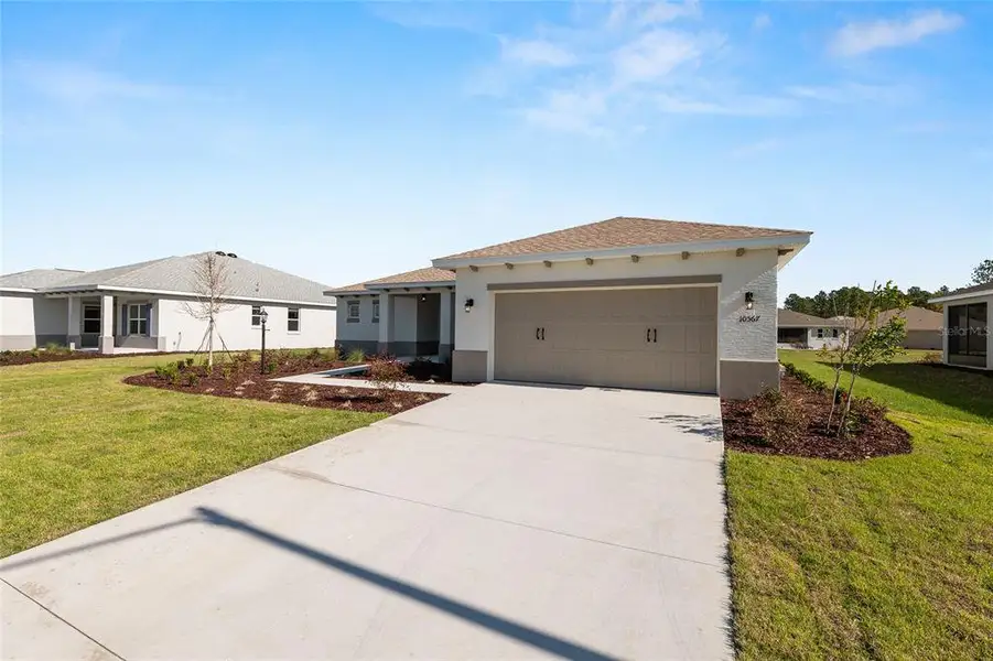 Front exterior of a new home in , Ocala, FL, highlighting curb appeal (Image 26).