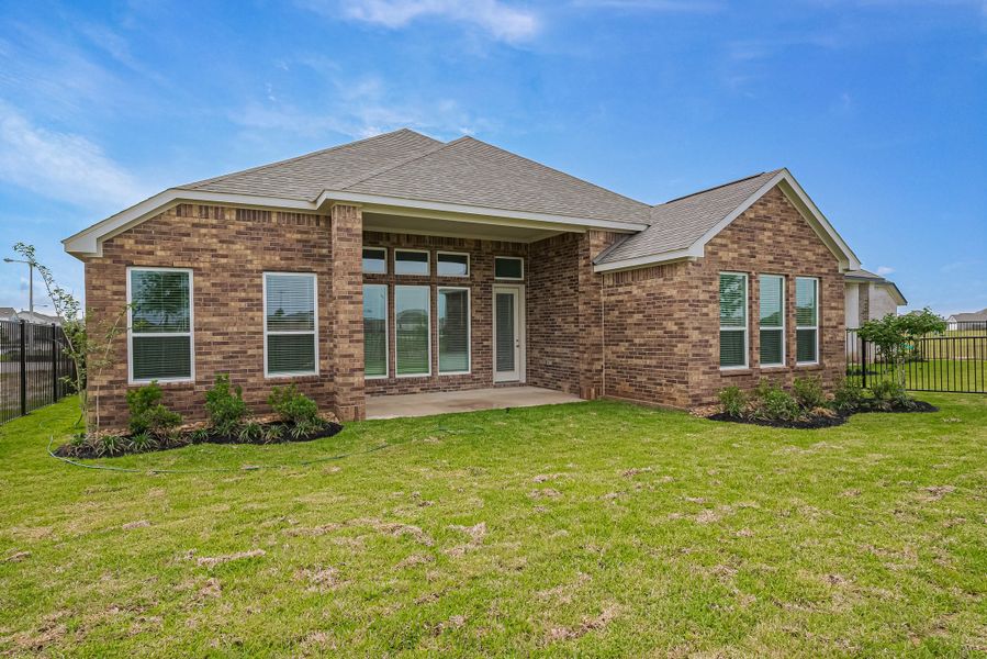 Representative exterior photo of a completed home built from the Floor Plan 2620 by Colina Homes in Woodland Lakes, Huffman, TX (Image 31). Representative exterior photo of a completed home built from the Floor Plan 2620 by Colina Homes in Woodland Lakes, Huffman, TX (Image 31).