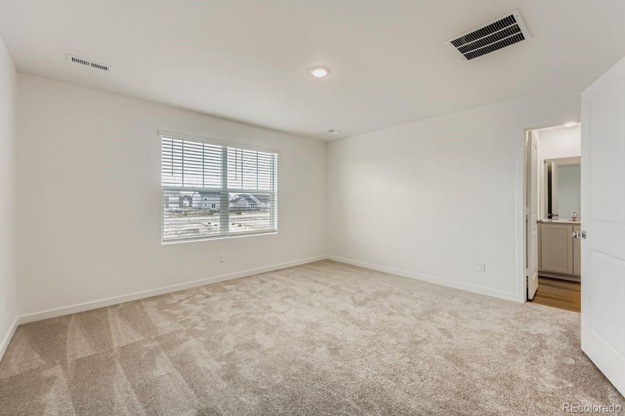 Spacious, unfurnished interior of a new home in Percheron: The Explorer Collection, Colorado Springs (Image 9).