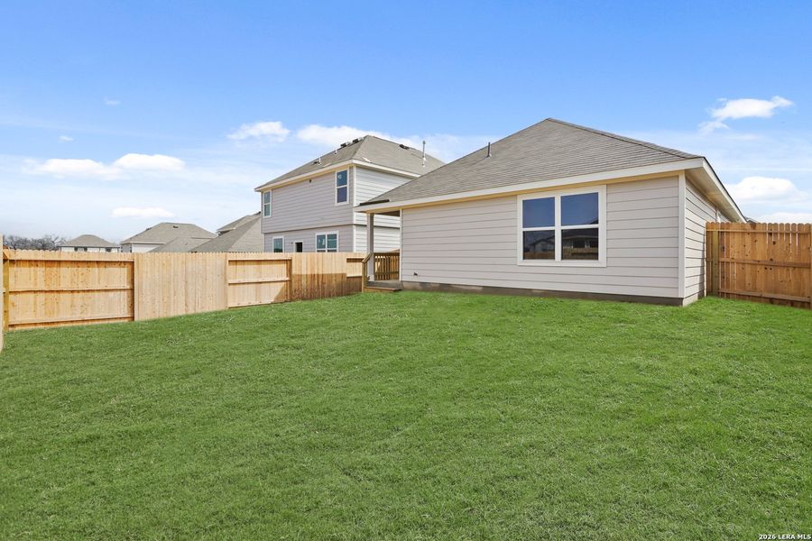 Exterior details and patio area of a home in Hickory Ridge, Elmendorf (Image 20).