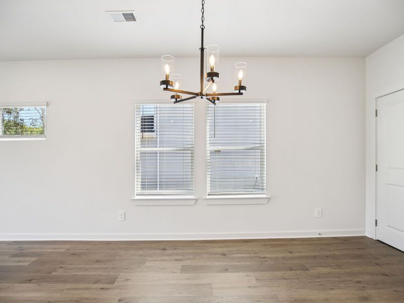 The open-concept floorplan allows for an easy flow between the kitchen and dining areas.