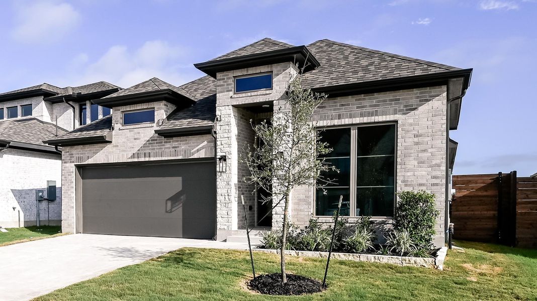 Front exterior of a new home in Juniper Springs, Lockhart, TX, highlighting curb appeal (Image 2).