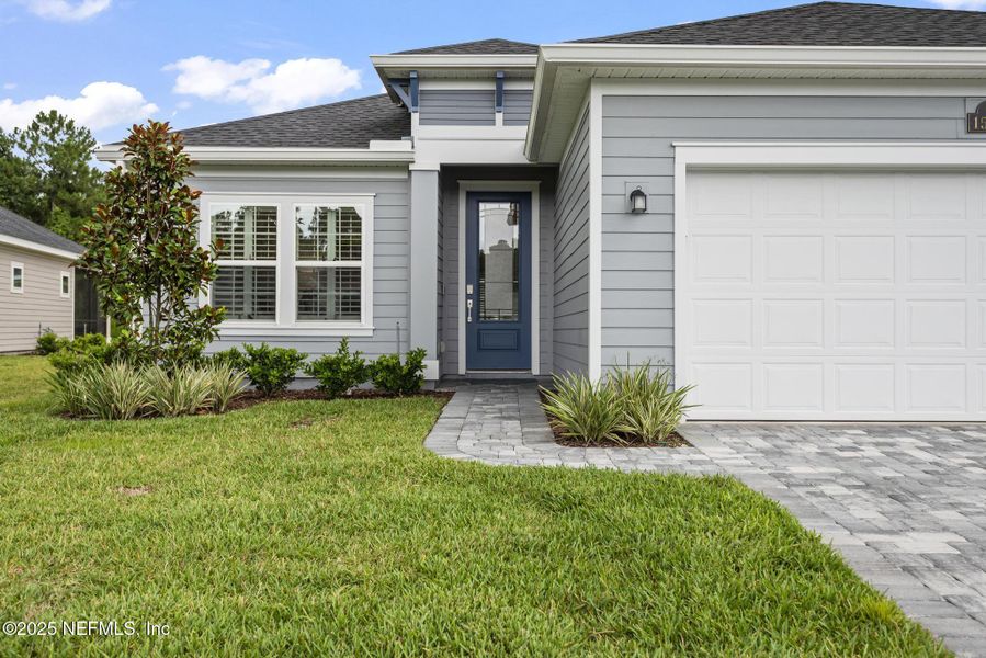 Front exterior of a new home in Stillwater | Active Adult 55+: Stillwater (50s) - Royal Collection, St. Johns, FL, highlighting curb appeal (Image 19). Front exterior of a new home in Stillwater | Active Adult 55+: Stillwater (50s) - Royal Collection, St. Johns, FL, highlighting curb appeal (Image 19).