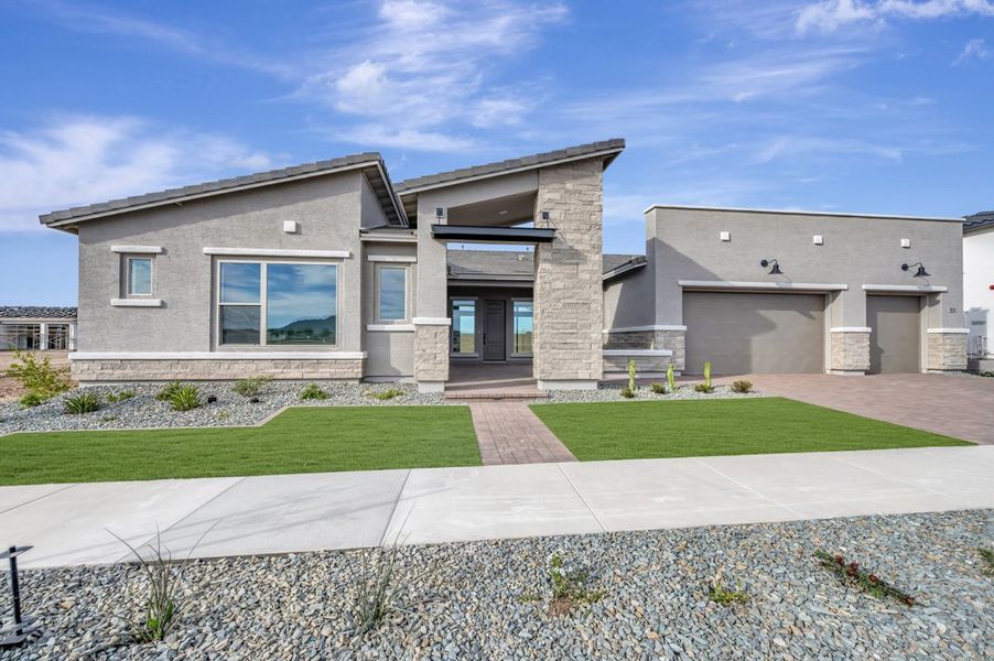 Front exterior of a new home in Suelo at Legado West, Queen Creek, AZ, highlighting curb appeal (Image 1). Front exterior of a new home in Suelo at Legado West, Queen Creek, AZ, highlighting curb appeal (Image 1).