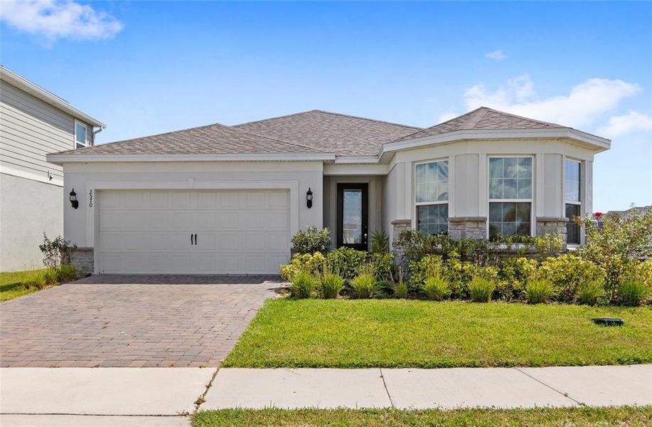 Front exterior of a new home in , Kissimmee, FL, highlighting curb appeal (Image 22). Front exterior of a new home in , Kissimmee, FL, highlighting curb appeal (Image 22).