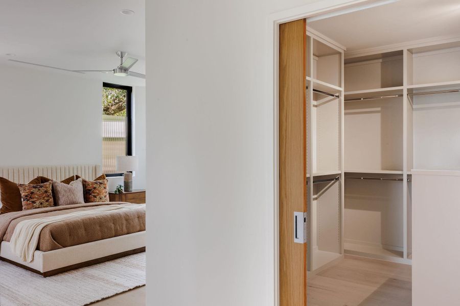 Bedroom with wood finished floors and a closet Bedroom with wood finished floors and a closet