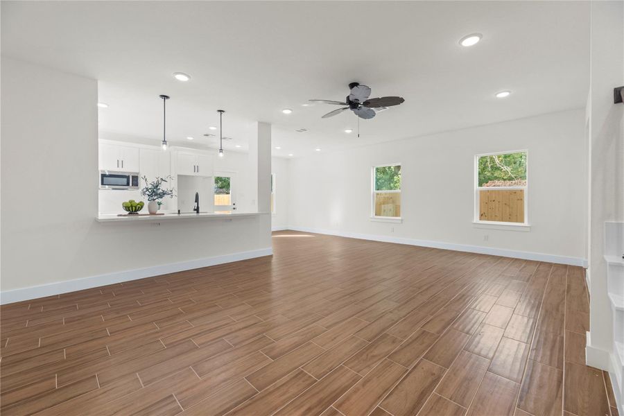 Welcoming and conveying warmth, the living room offers an inviting space for evening movies or holiday gatherings. Welcoming and conveying warmth, the living room offers an inviting space for evening movies or holiday gatherings.