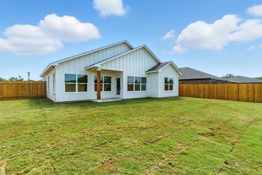 Front exterior of a new home in , Springtown, TX, highlighting curb appeal (Image 1).