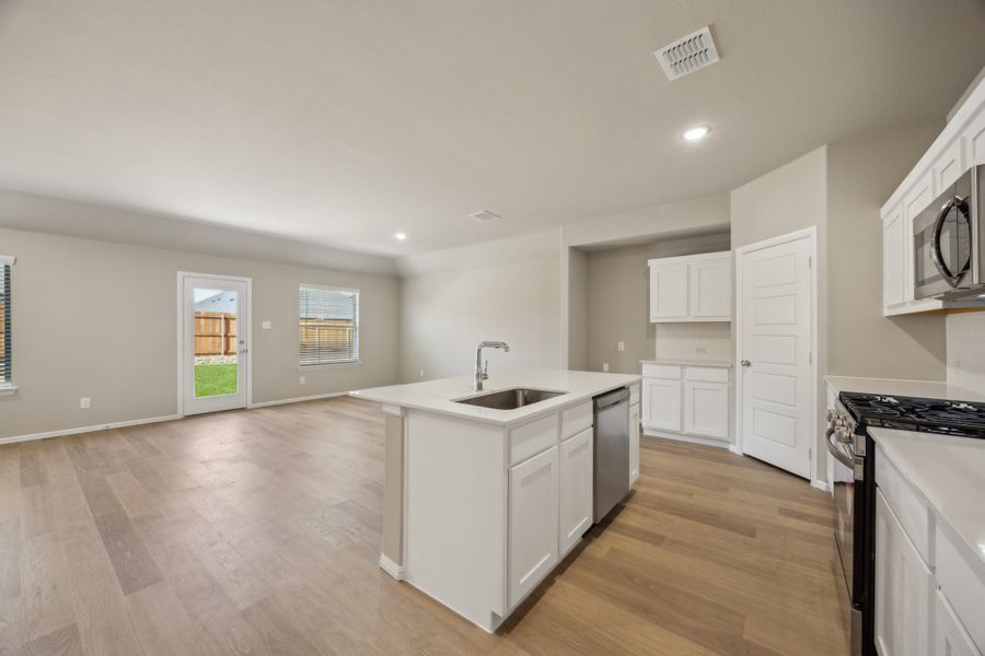 Kitchen in the Harper home plan by Trophy Signature Homes – REPRESENTATIVE PHOTO