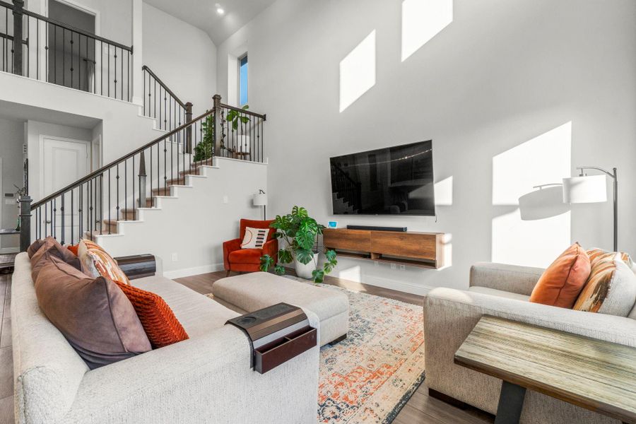 The Kitchen, Living Room, and Breakfast Nook flow seamlessly in this amazing floor plan. Motorized blinds are just another perk of this great room!