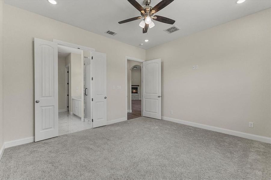 Unfurnished bedroom with carpet, recessed lighting, and ceiling fan