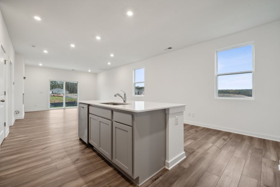 A kitchen with wooden floors. A kitchen with wooden floors.